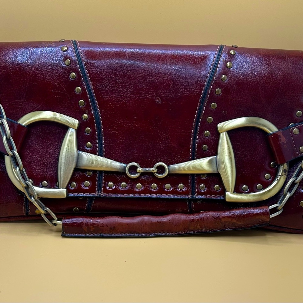Rina Rich handbag. On trend burgundy leather